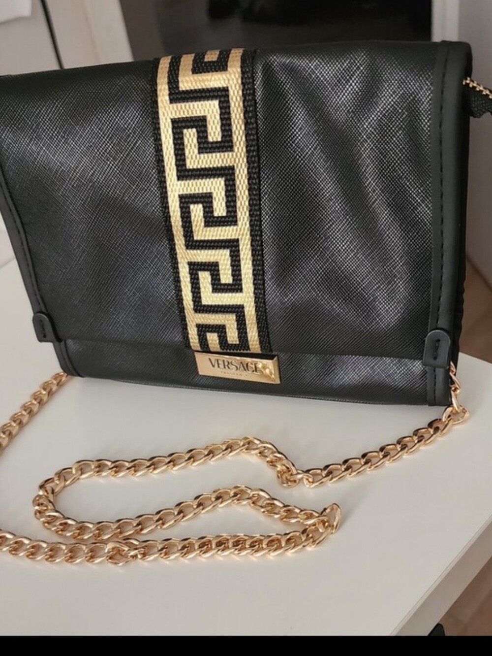 Versace Luxurious Black, Gold Zipper Mini Clutch Bag With Gold Chain Strap